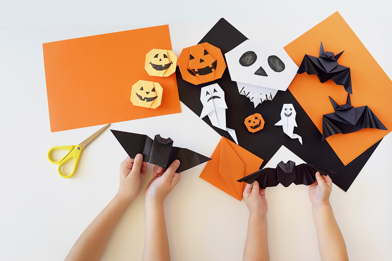 Examples of Halloween origami - ghosts, bats and pumpkins.